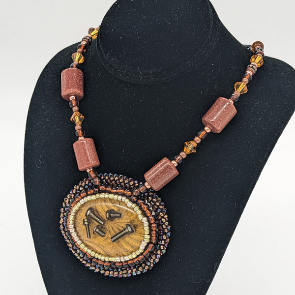 Loose Screws Necklace in Bronze
