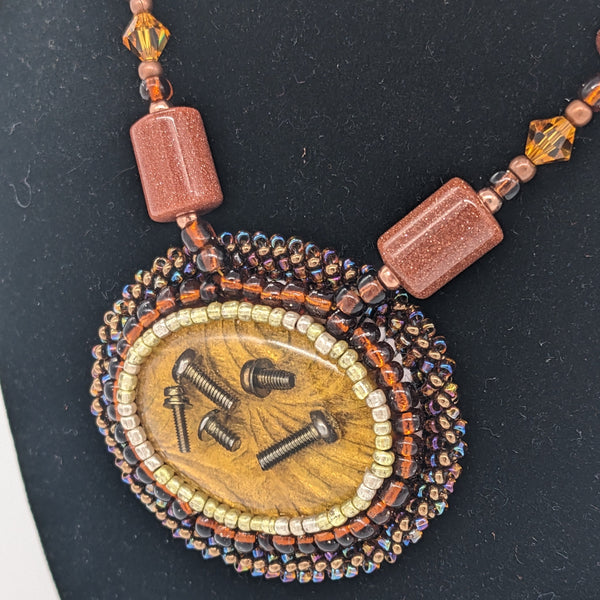 Loose Screws Necklace in Bronze