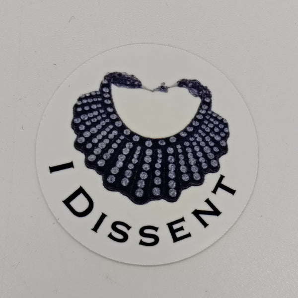 Image featuring RBG's Dissent Collar and the words 'I Dissent'