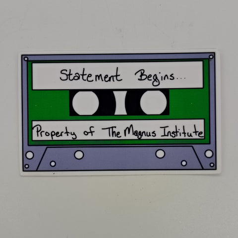 A sticker of a cassette tape with the words 'statement begins' and 'property of the magnus archives.'