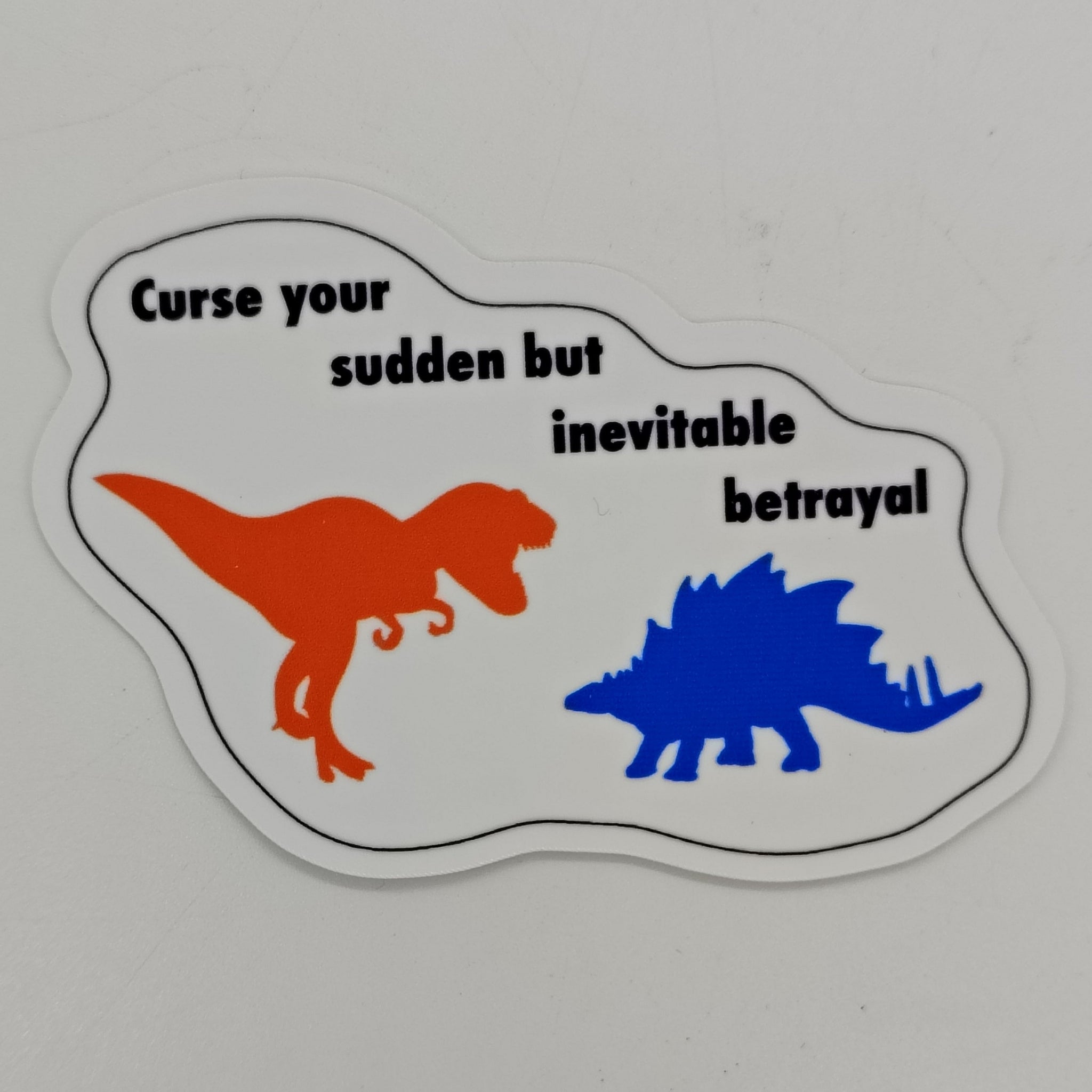 Orange t-rex and blue stegosaurus with the words 'curse your sudden but inevitable betrayal.'