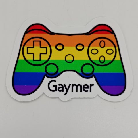 A rainbow on a game controller featuring the word 'gaymer'