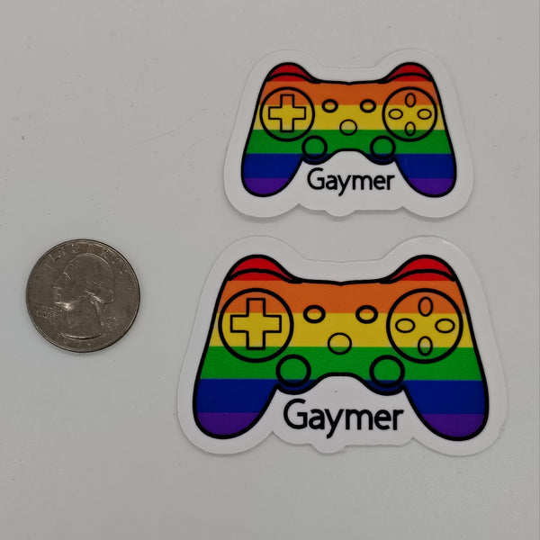 Two rainbow game controllers and the word 'gaymer'