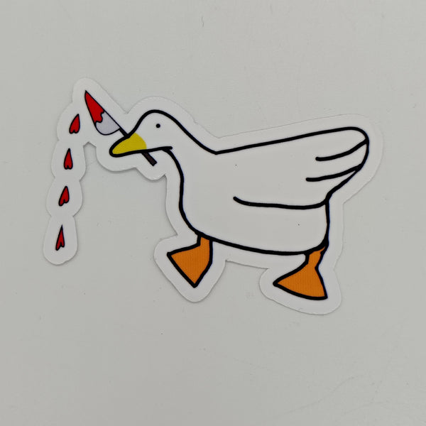 a goose with a knife in its mouth dripping blood in the shape of hearts