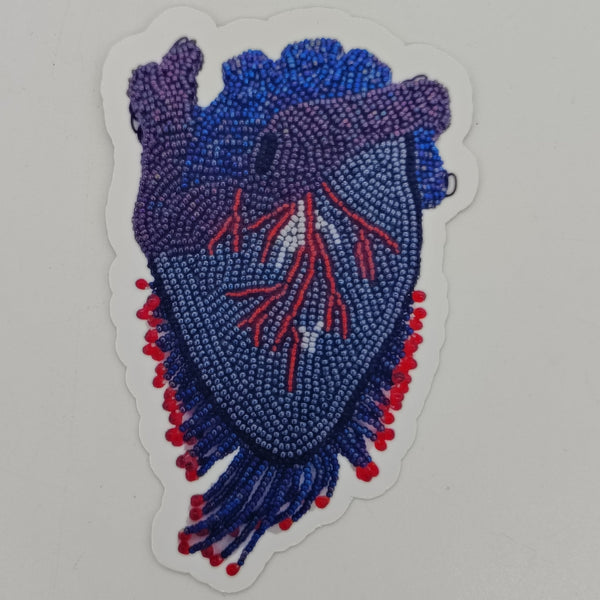 a sticker made from an image of a beaded blue and purple heart