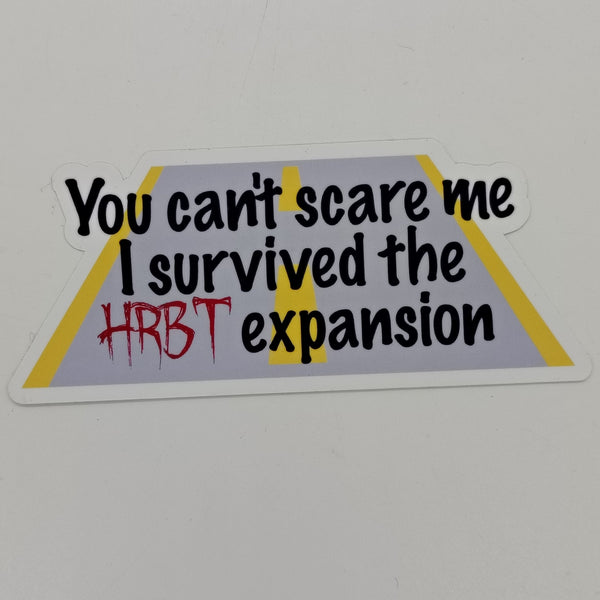 a sticker that says 'you can't scare me I survived the HRBT expansion' over a graphic of a road